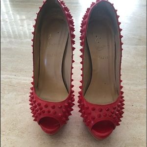 Christian Louboutin red spike peep toe heels